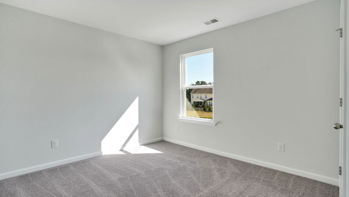 The second floor is complete with 3 additional bedrooms, a shared bathroom, storage & laundry room.