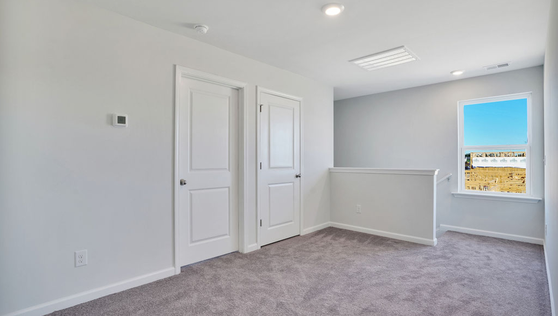 The second floor is complete with 3 additional bedrooms, a shared bathroom, storage & laundry room.