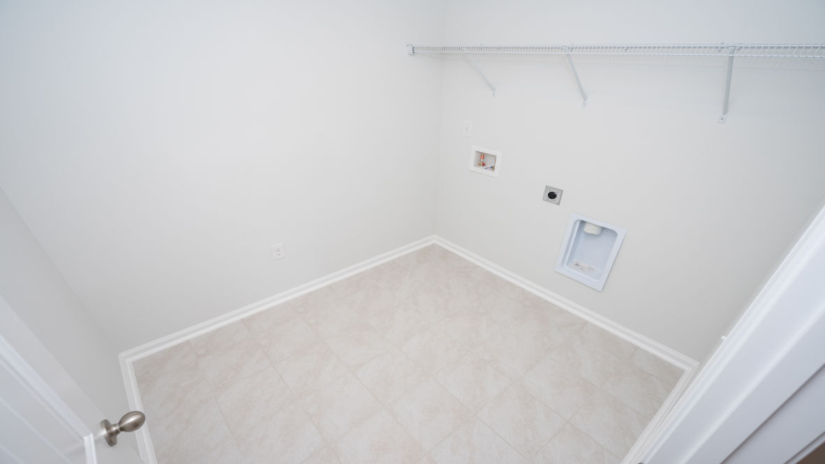 The second floor is complete with 3 additional bedrooms, a shared bathroom, storage & laundry room.