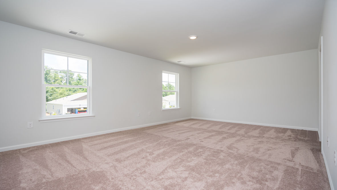 The second floor is complete with 3 additional bedrooms, a shared bathroom, storage & laundry room.