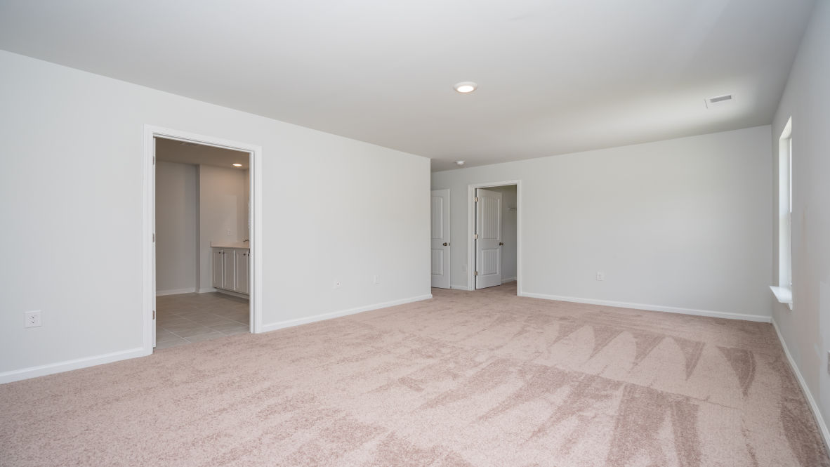 The second floor is complete with 3 additional bedrooms, a shared bathroom, storage & laundry room.