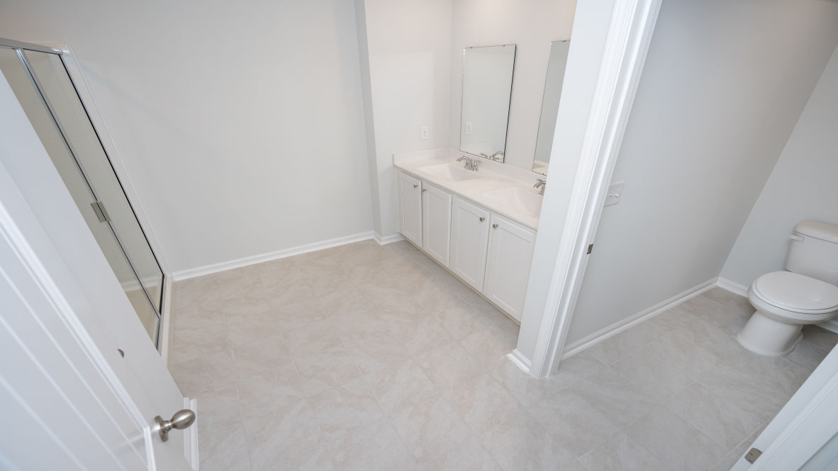 The second floor is complete with 3 additional bedrooms, a shared bathroom, storage & laundry room.