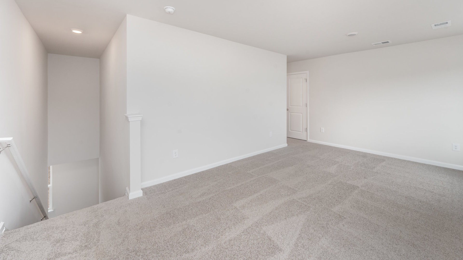 The primary bedroom suite and laundry room are conveniently located on the first floor, as well.