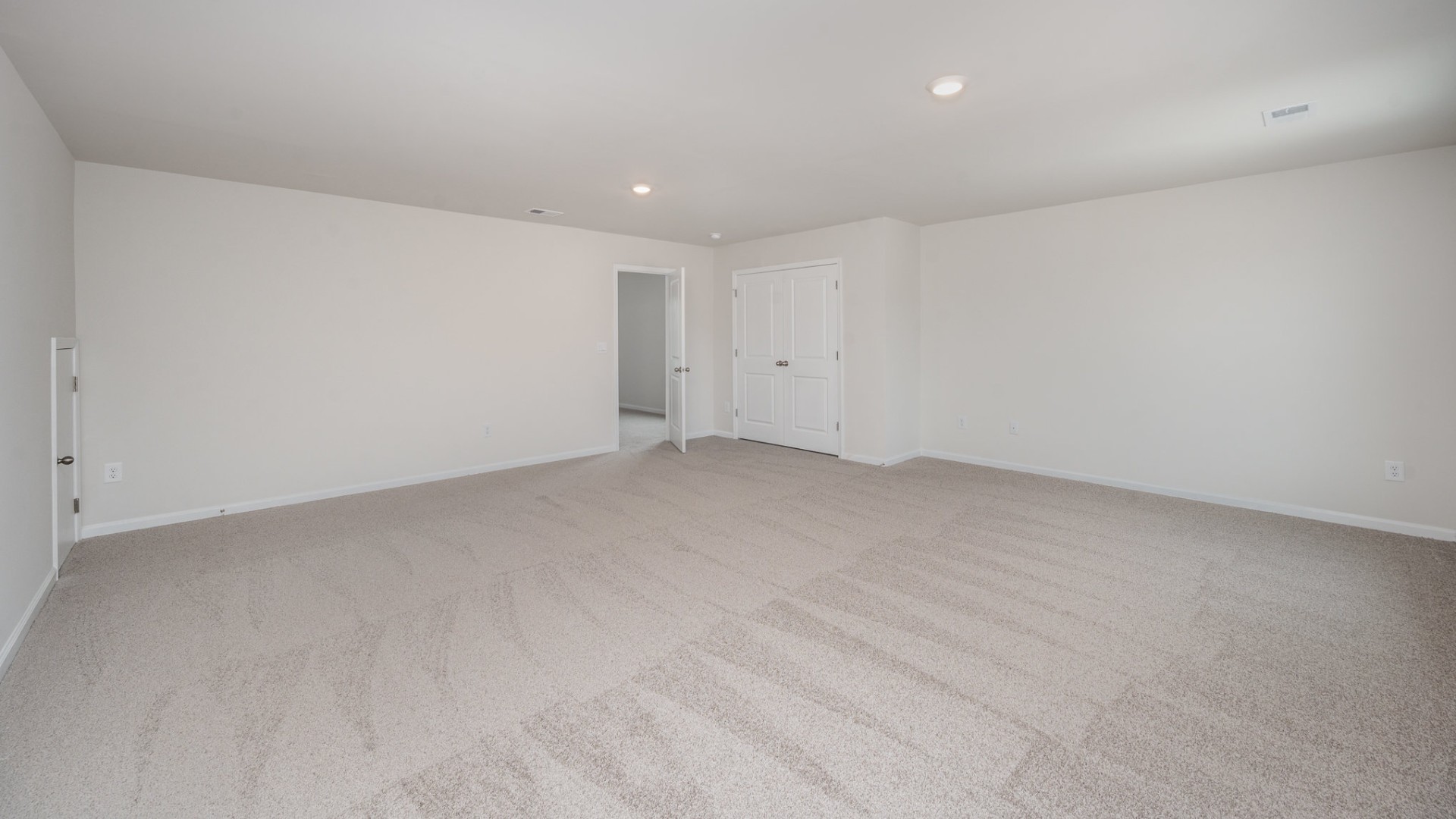 The primary bedroom suite and laundry room are conveniently located on the first floor, as well.