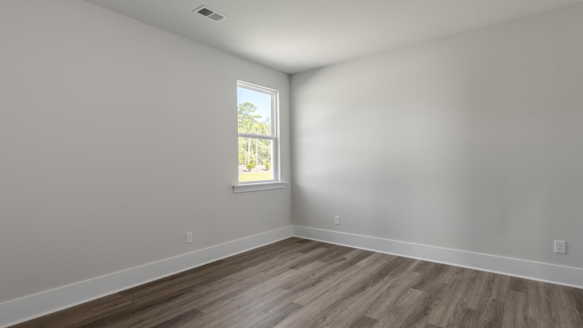 The primary bedroom suite and laundry room are conveniently located on the first floor, as well.