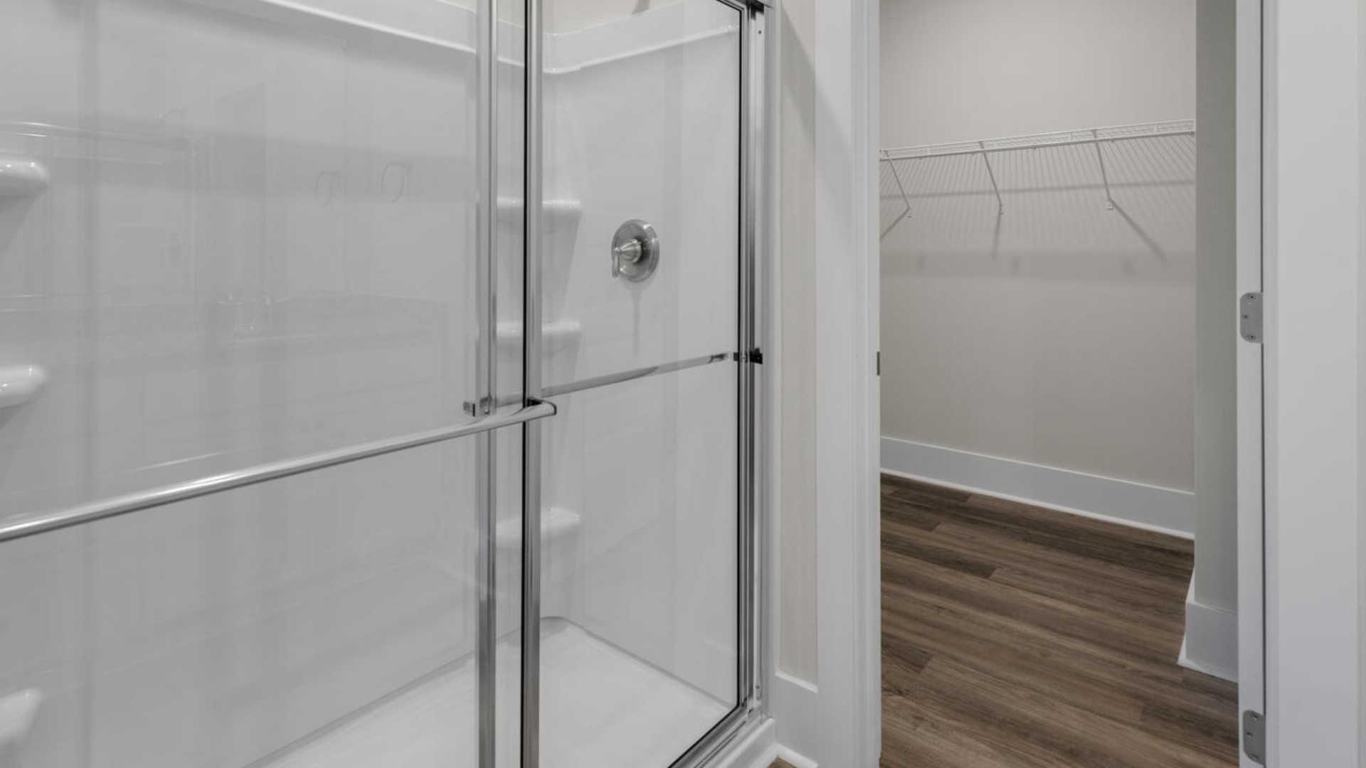 The primary bedroom suite and laundry room are conveniently located on the first floor, as well.