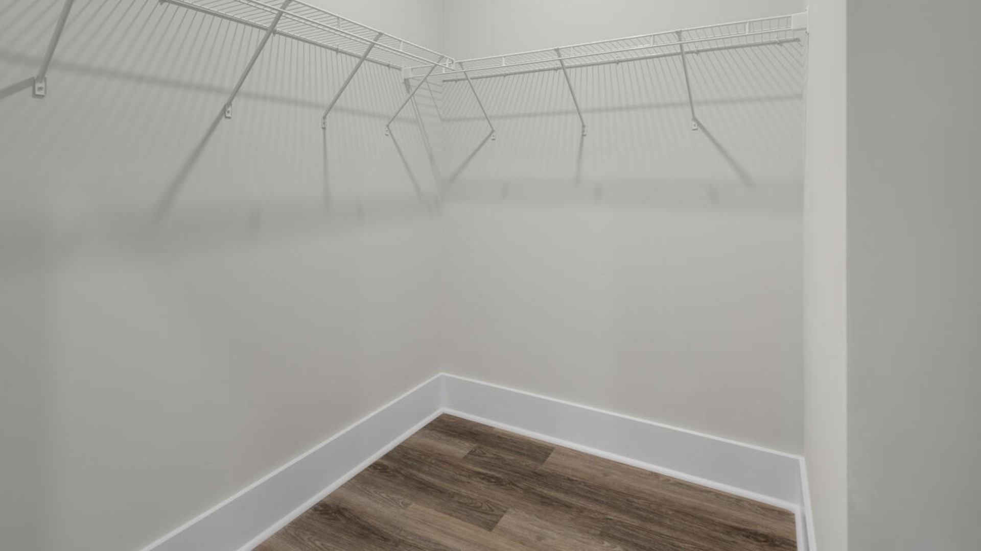 The primary bedroom suite and laundry room are conveniently located on the first floor, as well.