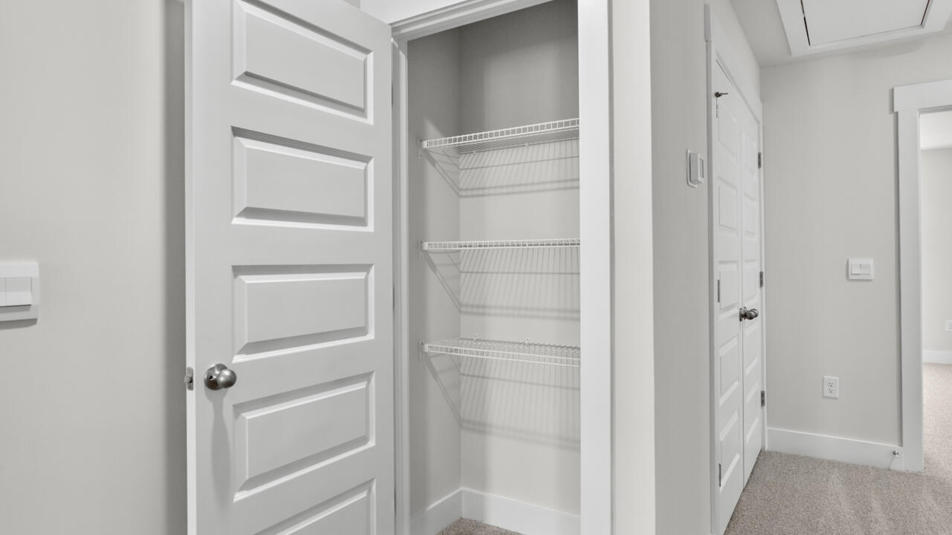 The second floor features the primary bedroom with a walk-in closet and double vanities.