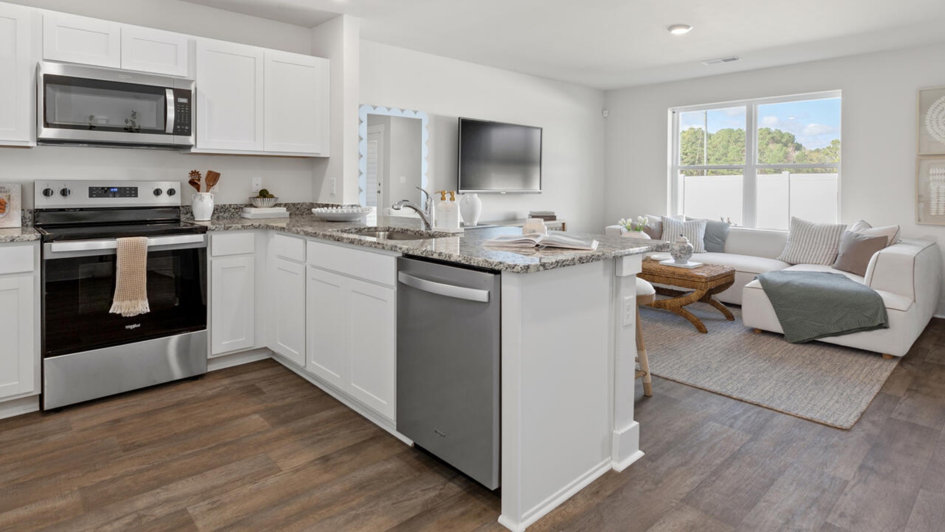 The kitchen overlooks the dining and living spaces, ideal for entertaining guests or enjoying family time while preparing meals with new stainless-steel appliances, walk-in pantry and granite countertops. You’ll love the open concept design, never too far from the action with the living and dining area right there.