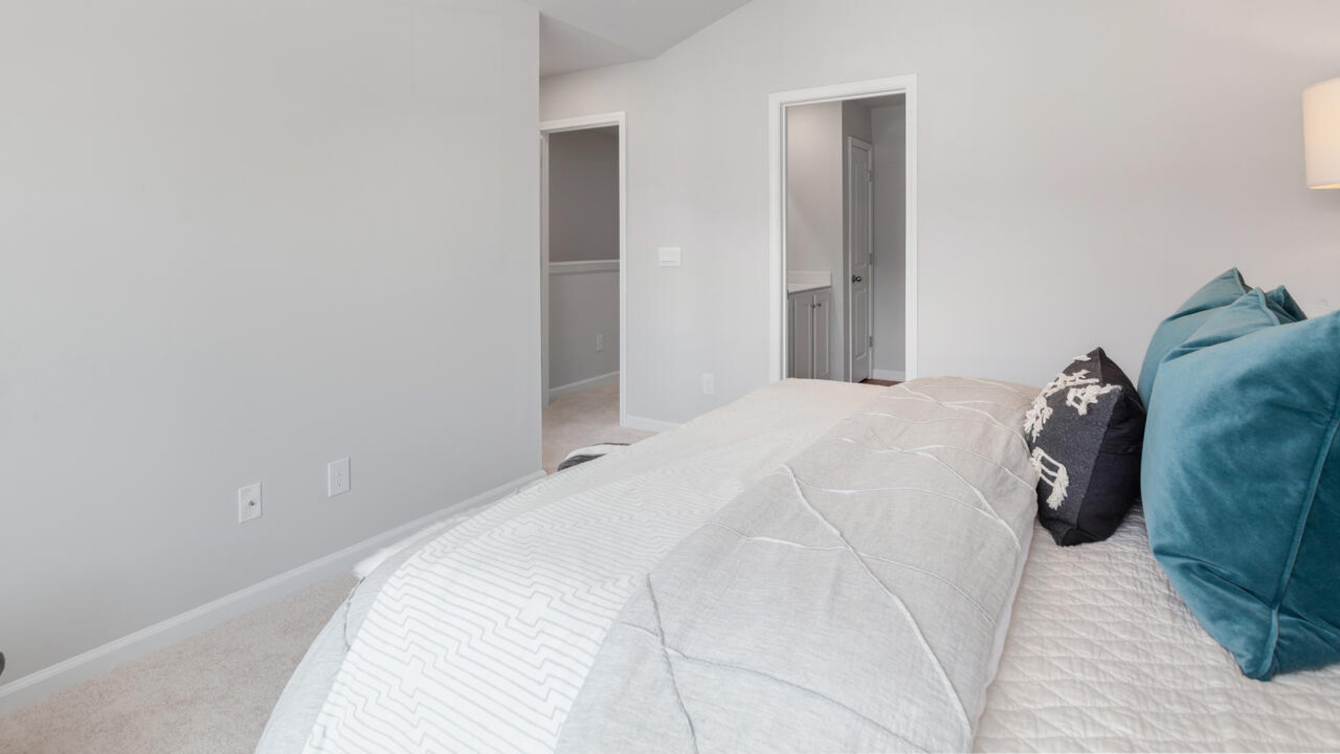 Upstairs, you'll find a generous primary suite featuring a walk-in closet, along with two additional guest bedrooms and a shared full bath, perfect for family or flexible living space. This thoughtfully designed layout provides the privacy you need with all the function you want.