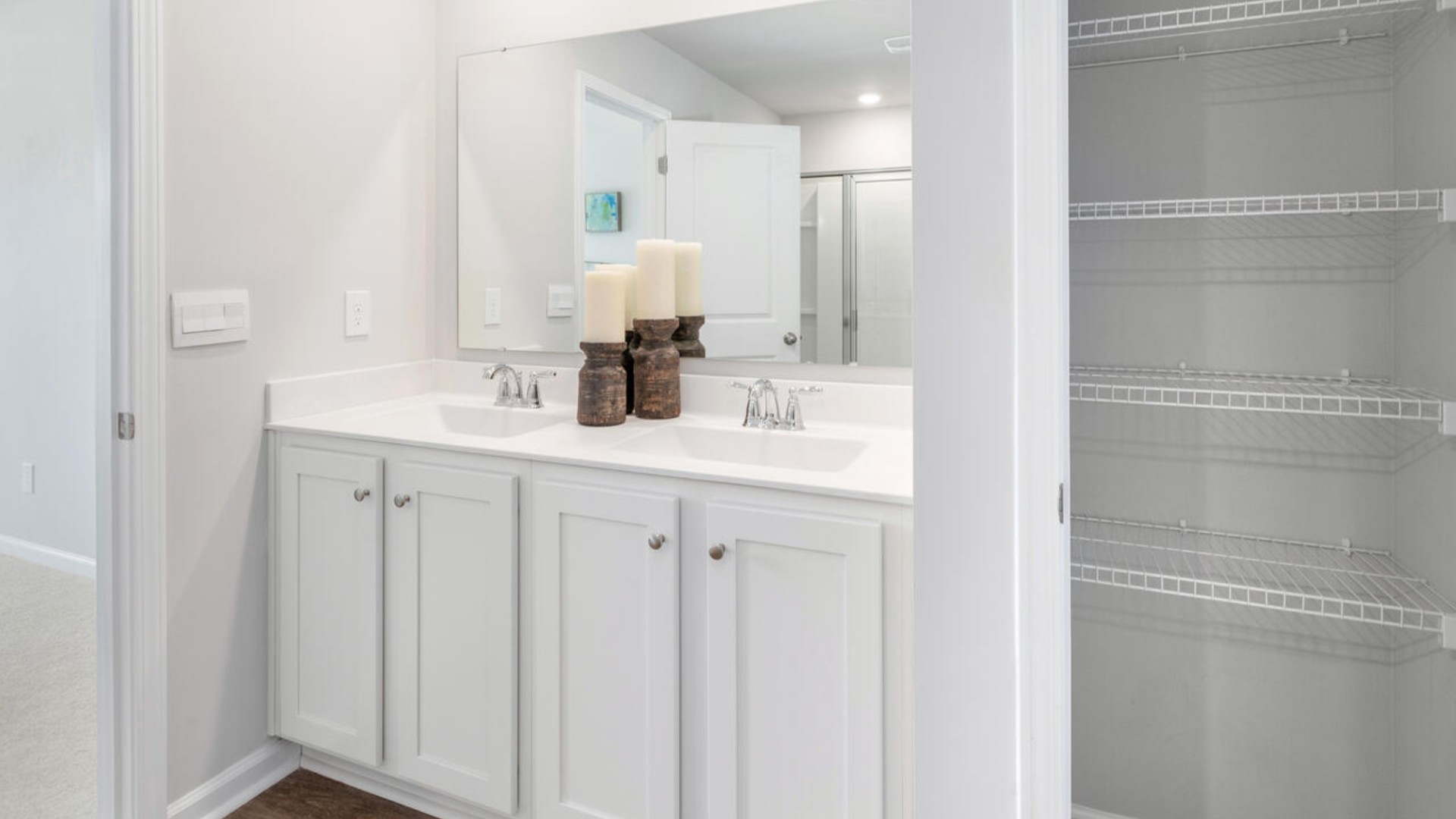 Upstairs, you'll find a generous primary suite featuring a walk-in closet, along with two additional guest bedrooms and a shared full bath, perfect for family or flexible living space. This thoughtfully designed layout provides the privacy you need with all the function you want.