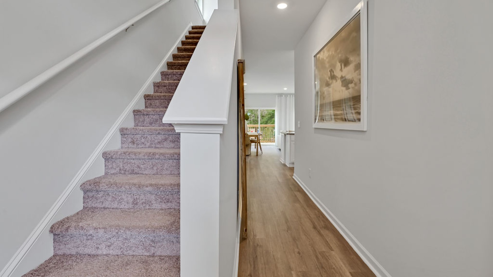 Upstairs, you'll find a generous primary suite featuring a walk-in closet, along with two additional guest bedrooms and a shared full bath, perfect for family or flexible living space. This thoughtfully designed layout provides the privacy you need with all the function you want.