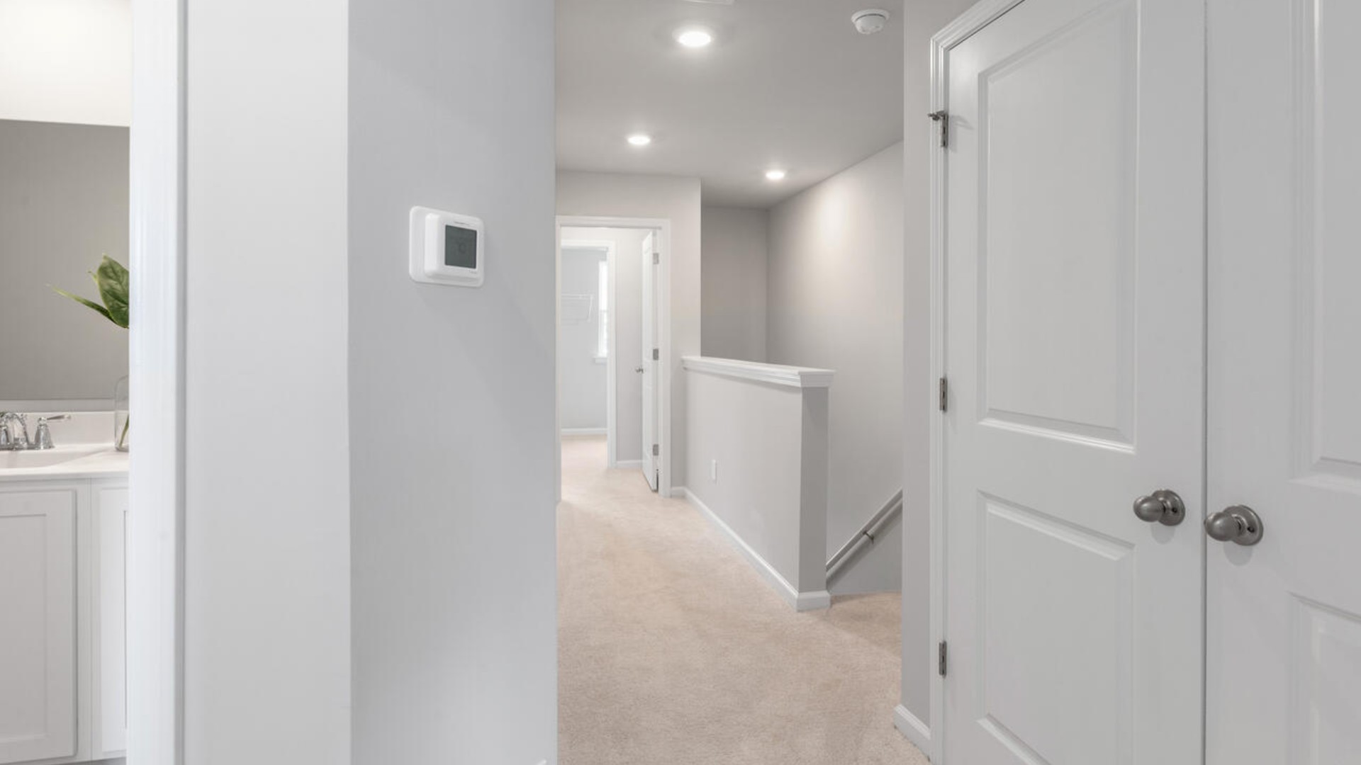 Upstairs, you'll find a generous primary suite featuring a walk-in closet, along with two additional guest bedrooms and a shared full bath, perfect for family or flexible living space. This thoughtfully designed layout provides the privacy you need with all the function you want.