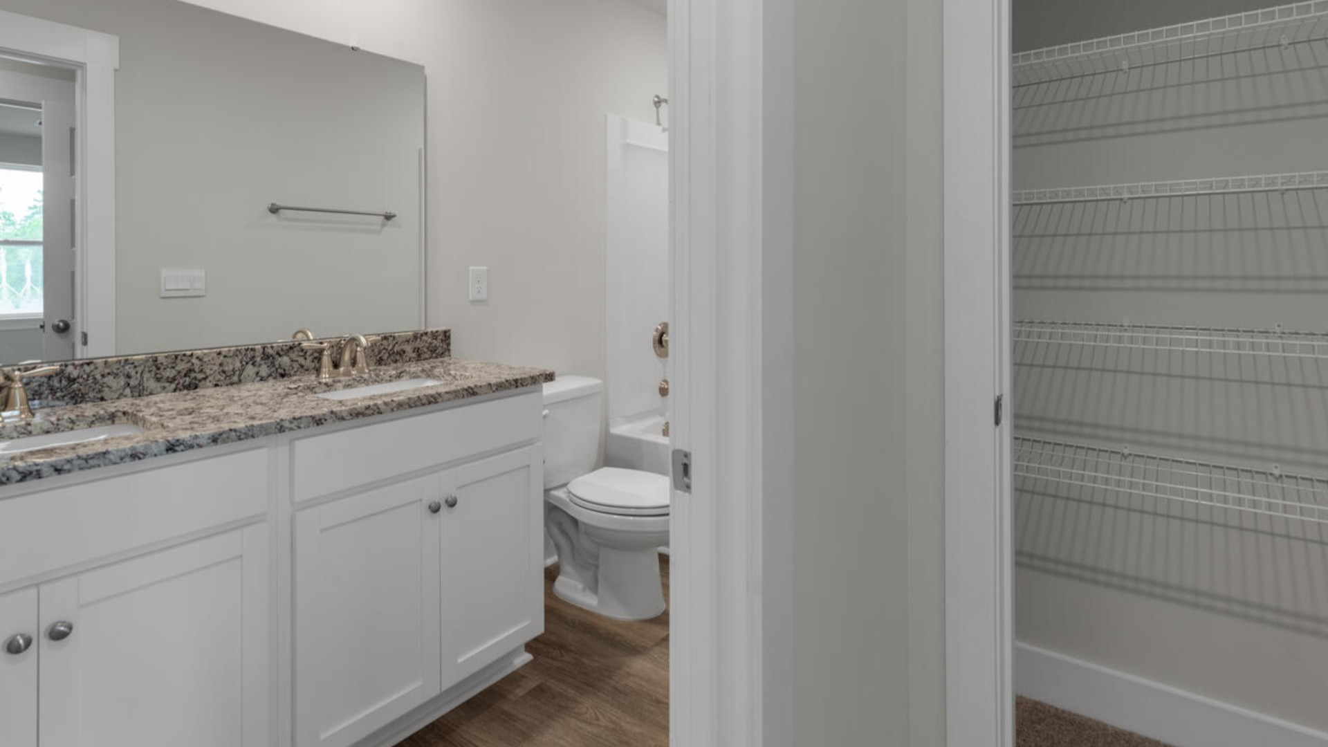 The second-floor primary bedroom is located at the front of the home and boasts a large bath and walk-in closet. There are additional 2 bedrooms, 2 full bathrooms and laundry room at the back of the home.