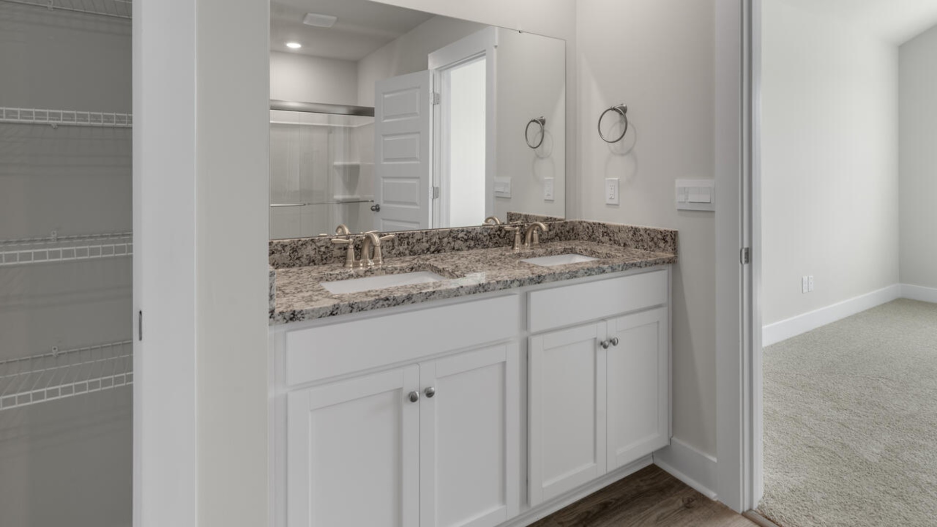 The second-floor primary bedroom is located at the front of the home and boasts a large bath and walk-in closet. There are additional 2 bedrooms, 2 full bathrooms and laundry room at the back of the home.