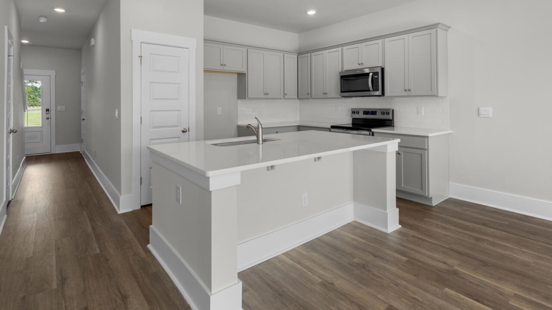 The kitchen features granite countertops, stainless steel appliances and large island which are sure to both turn heads and make meal prep easy. You’ll never be too far from the action with the living and dining area right there.