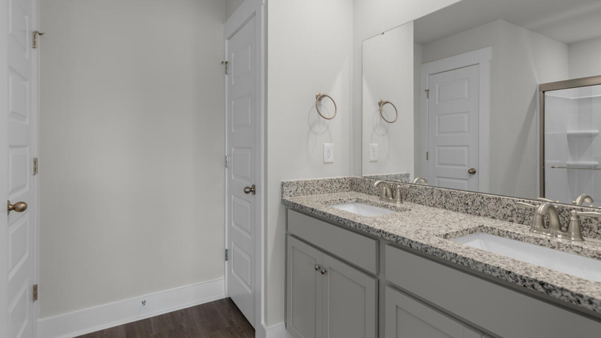 The second-floor primary bedroom is located at the front of the home and boasts a large bath and walk-in closet.