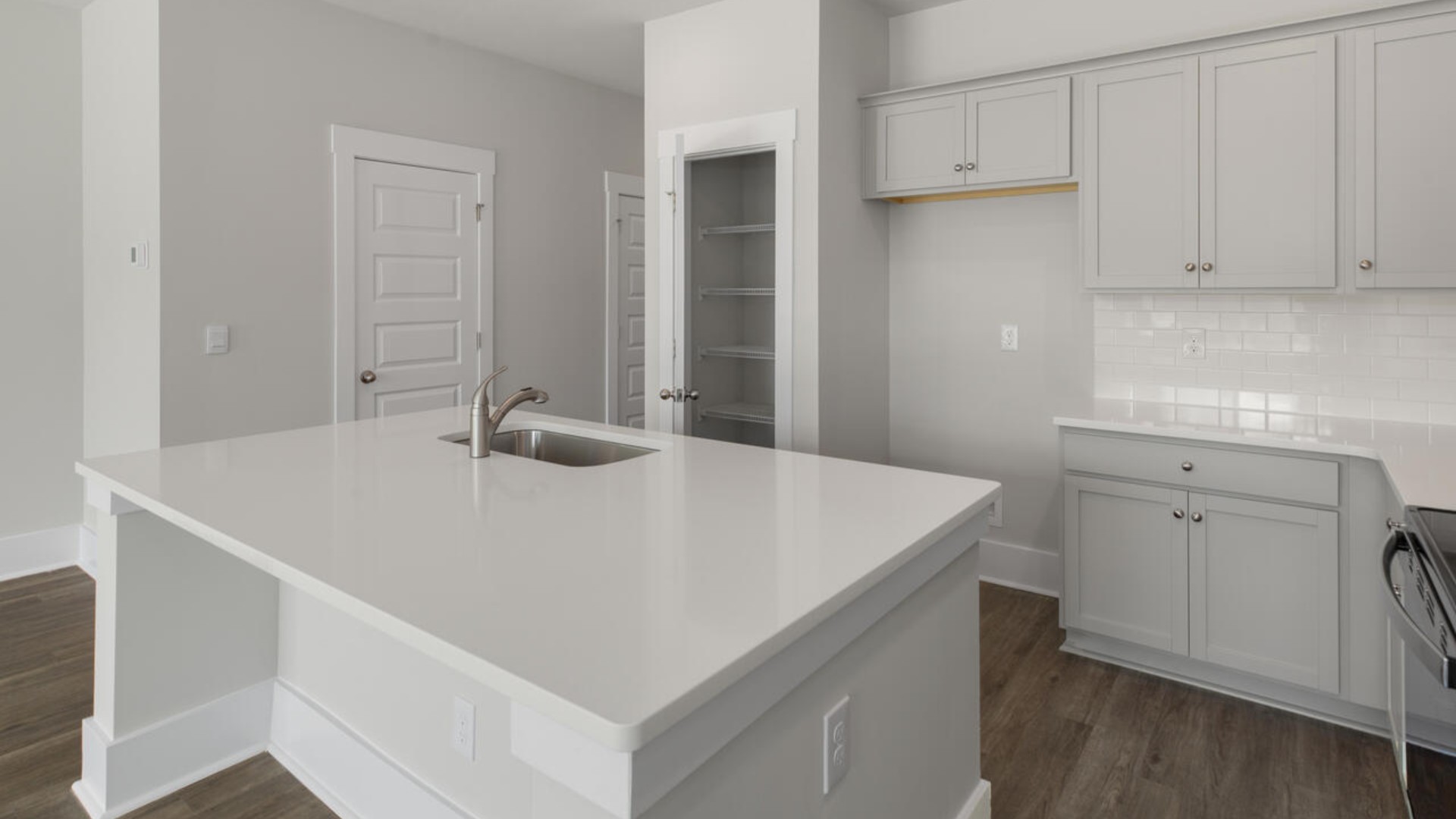 The kitchen features shaker-style cabinets, granite countertops, and stainless steel appliances, which are sure to both turn heads and make meal prep easy.