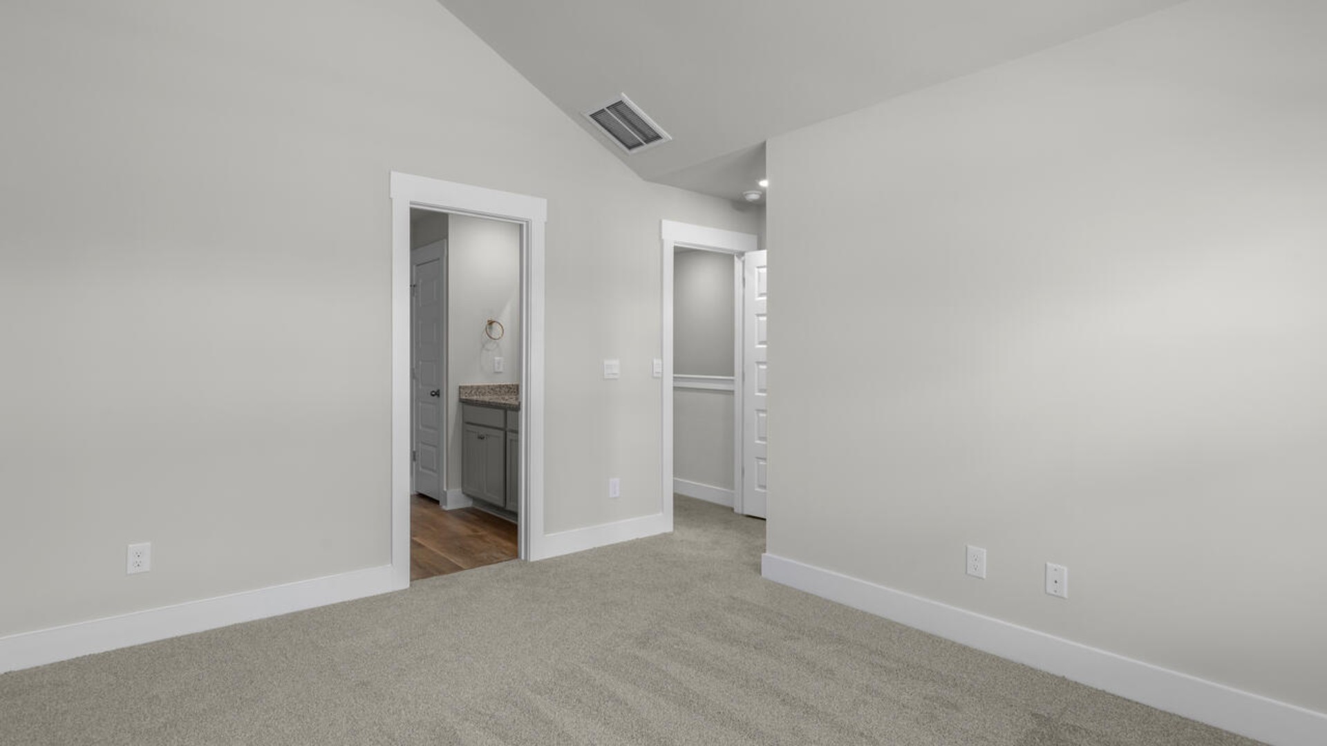 he second-floor primary bedroom is located at the front of the home and boasts a large bath and walk-in closet