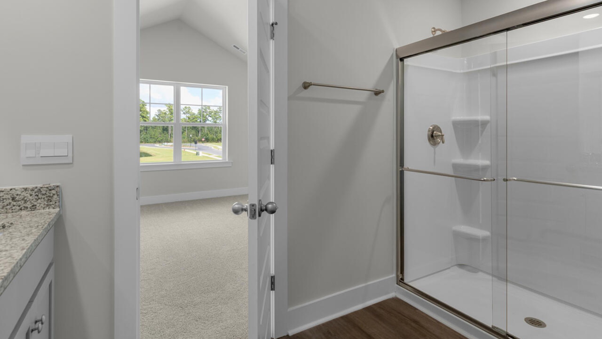 he second-floor primary bedroom is located at the front of the home and boasts a large bath and walk-in closet