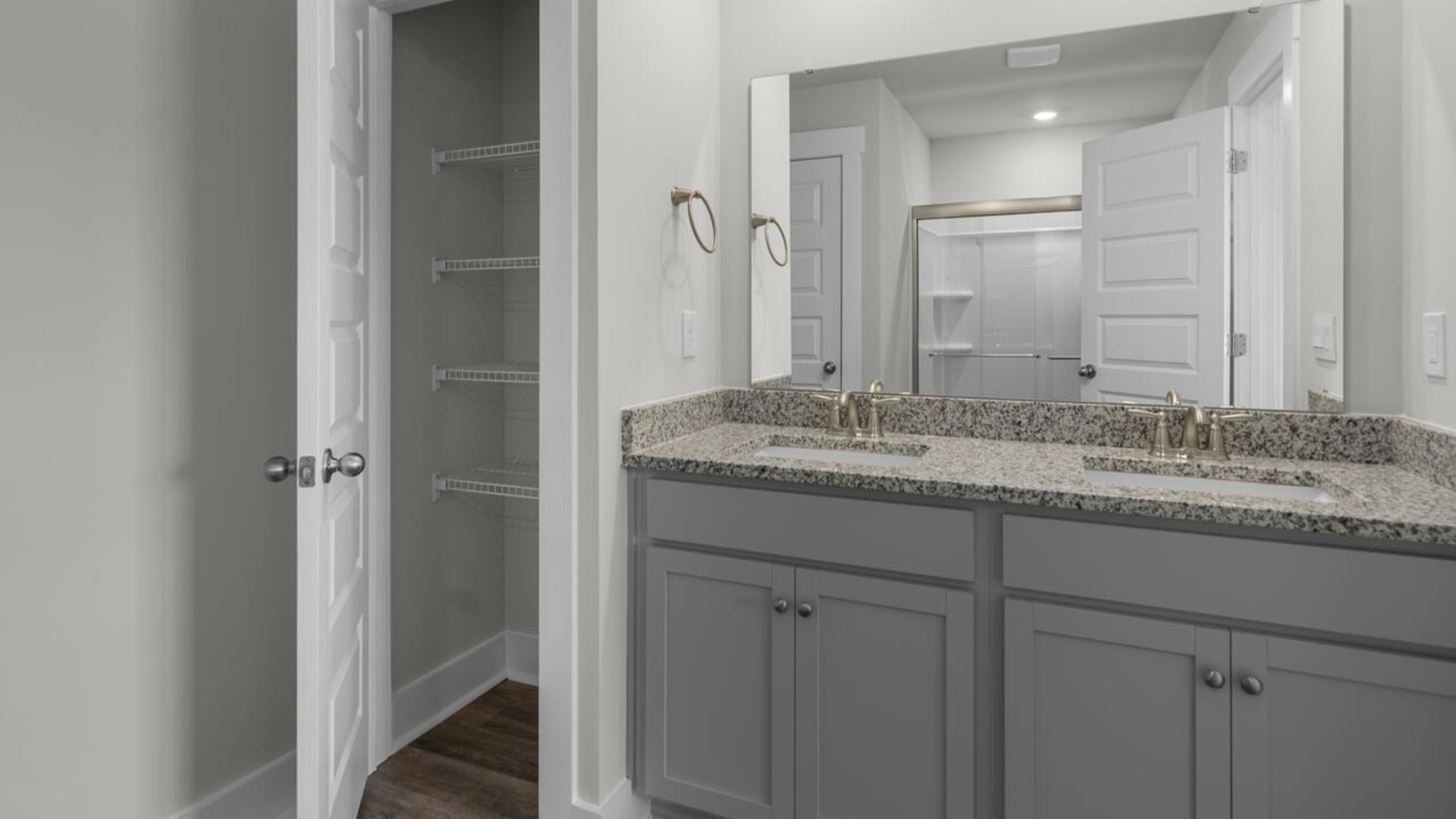 he second-floor primary bedroom is located at the front of the home and boasts a large bath and walk-in closet
