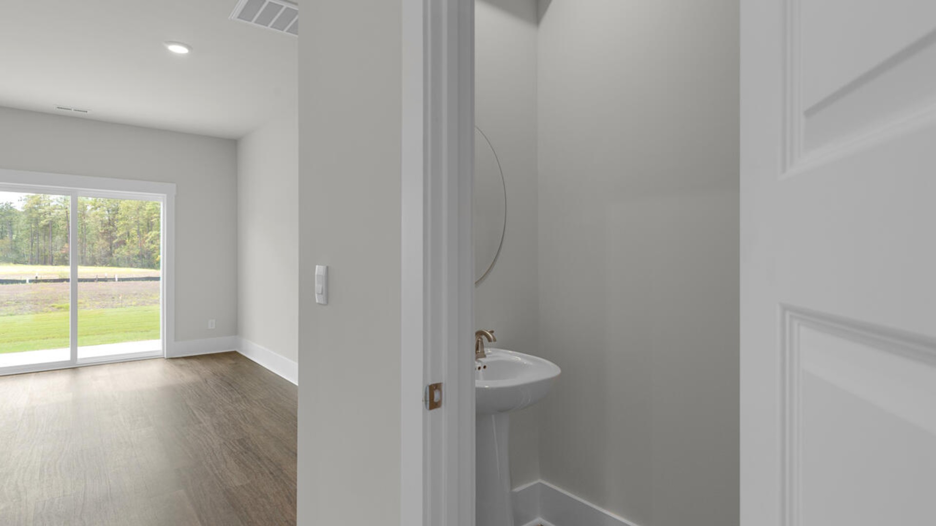 The second-floor primary bedroom is located at the front of the home and boasts a large bath and walk-in closet.