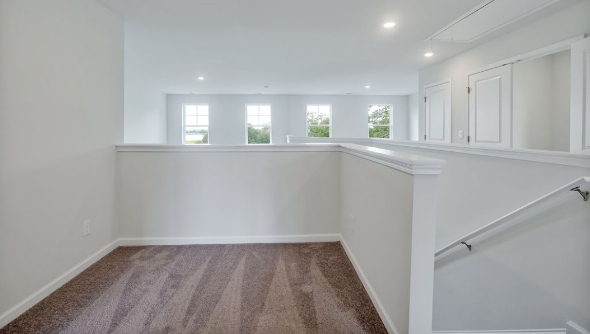 Upstairs, you'll find 2 additional bedrooms and a full bath, and a wonderful den area overlooking the living area on the main floor.