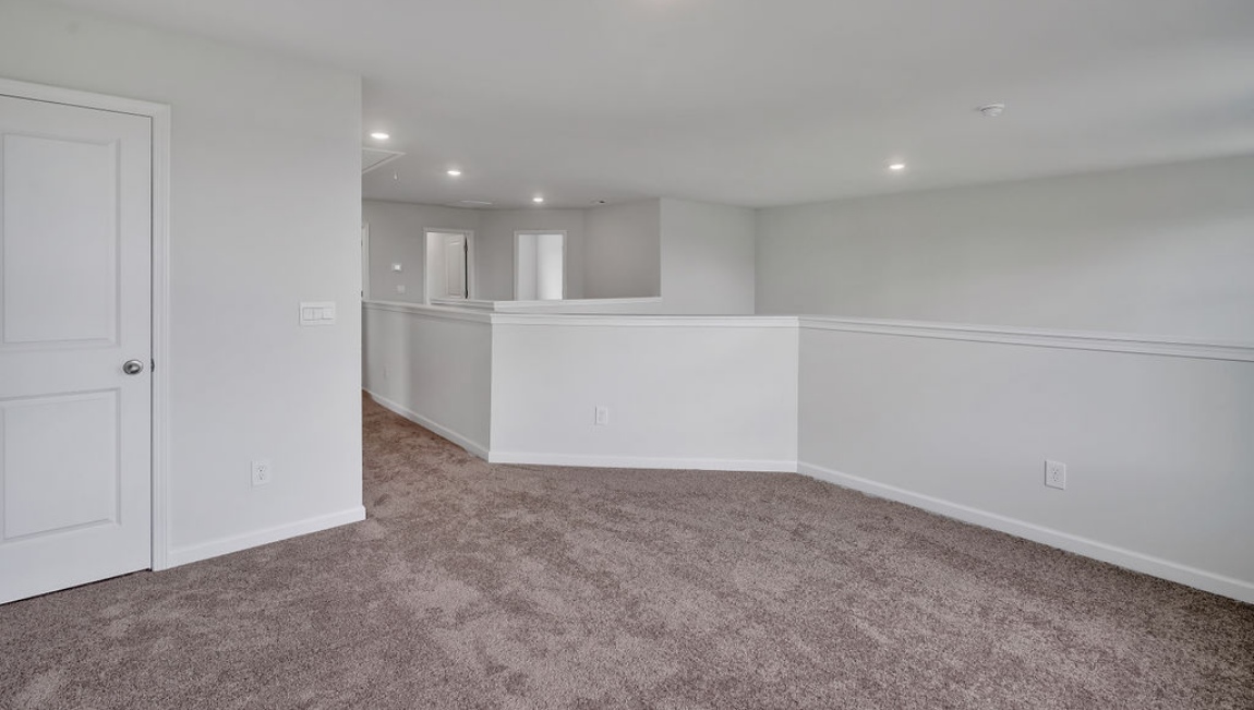 Upstairs, you'll find 2 additional bedrooms and a full bath, and a wonderful den area overlooking the living area on the main floor.