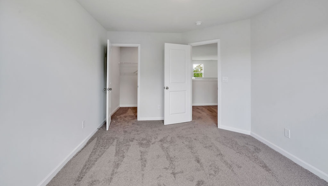 Upstairs, you'll find 2 additional bedrooms and a full bath, and a wonderful den area overlooking the living area on the main floor.