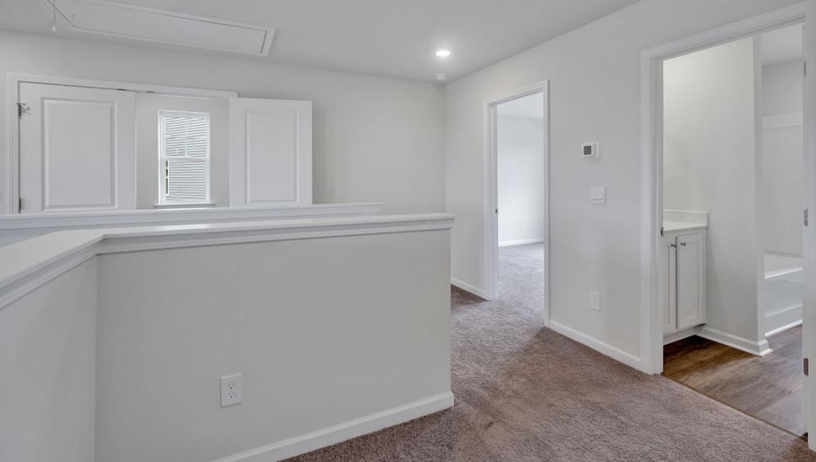 Upstairs, you'll find 2 additional bedrooms and a full bath, and a wonderful den area overlooking the living area on the main floor.