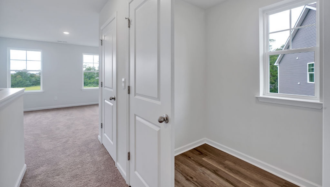 Upstairs, you'll find 2 additional bedrooms and a full bath, and a wonderful den area overlooking the living area on the main floor.