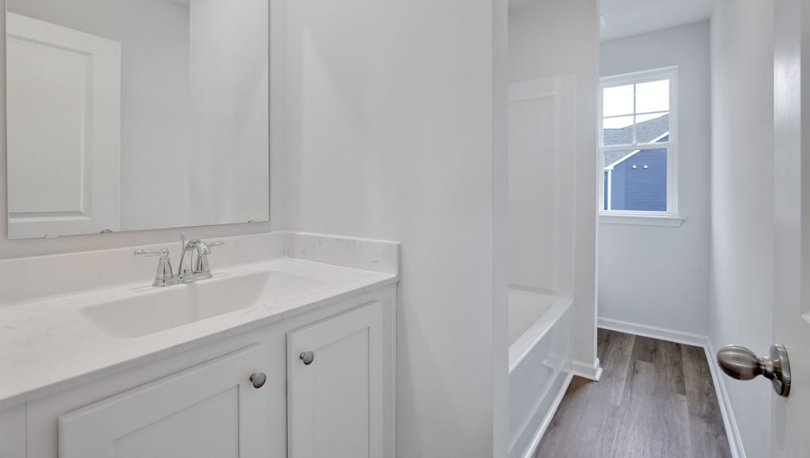 Upstairs, you'll find 2 additional bedrooms and a full bath, and a wonderful den area overlooking the living area on the main floor.