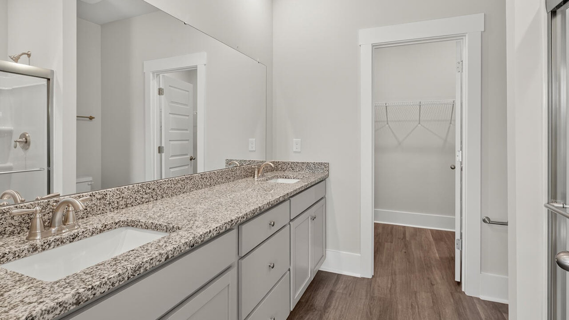 The primary bedroom has its own attached bathroom that features a walk-in closet and all the space you need to get ready in the morning. Sharing a sink isn’t a worry with the double vanity, and you also get additional privacy with a separate door for the toilet and shower.
