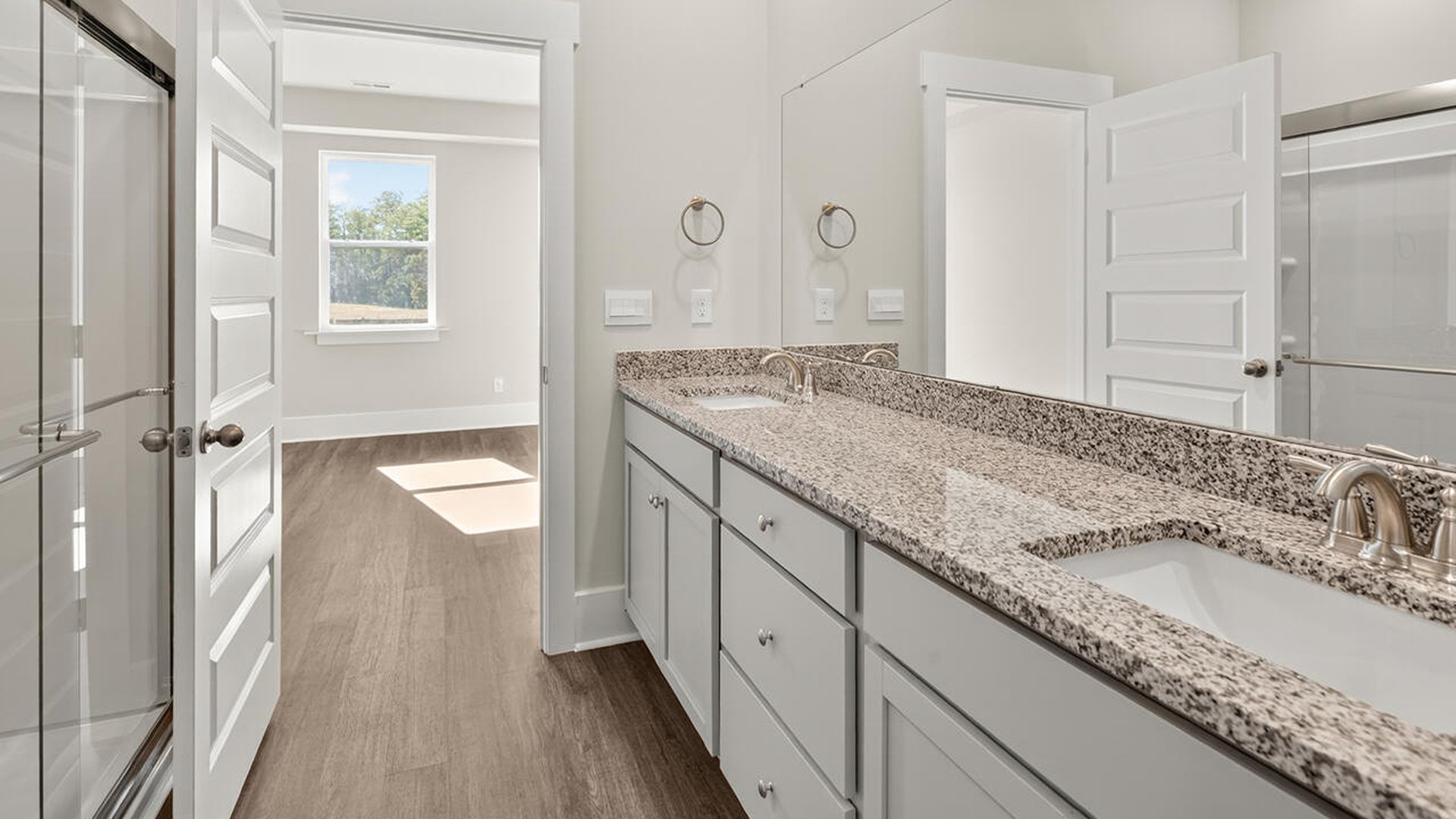 The primary bedroom has its own attached bathroom that features a walk-in closet and all the space you need to get ready in the morning. Sharing a sink isn’t a worry with the double vanity, and you also get additional privacy with a separate door for the toilet and shower.