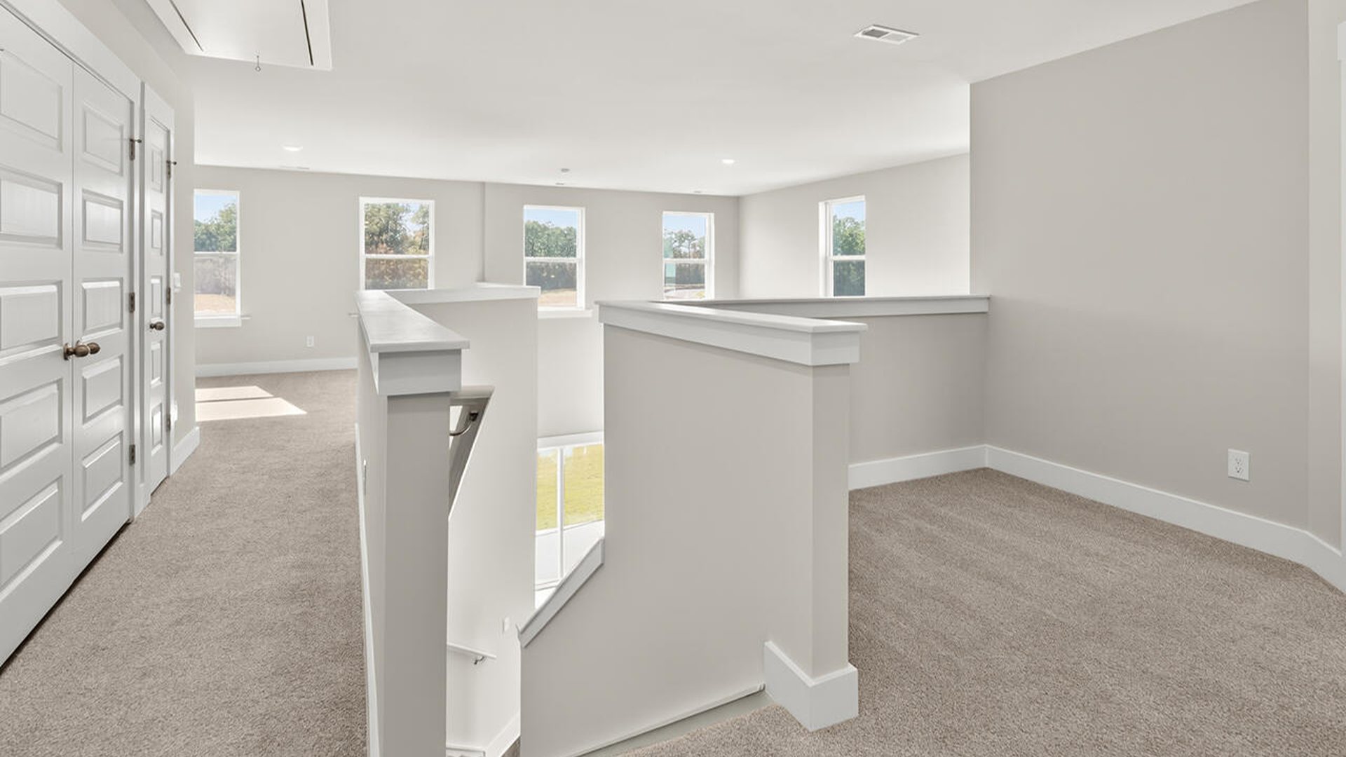 The first-floor primary bedroom boasts a large bath, double vanities and walk-in closet and convenient laundry room.