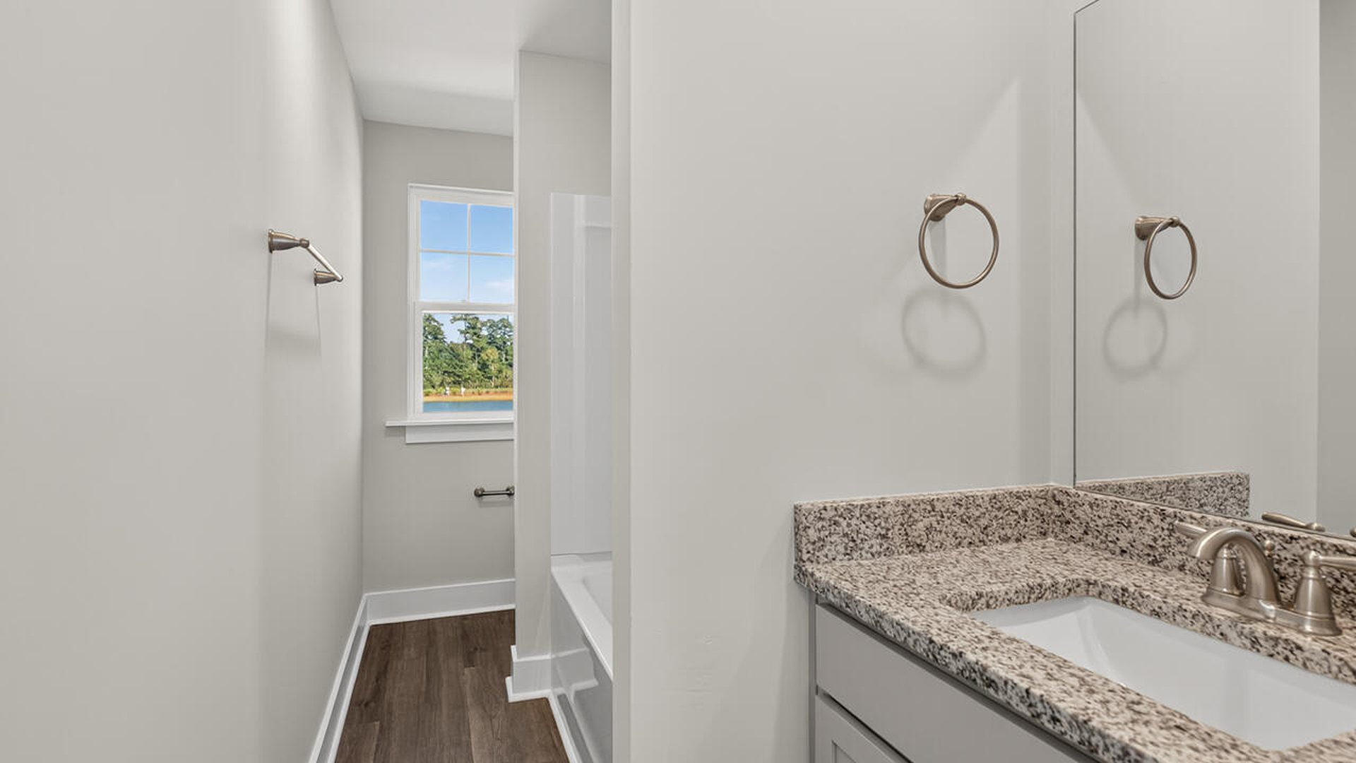 On the second floor, you are greeted by a versatile loft space, two secondary bedrooms, laundry and a full bath.