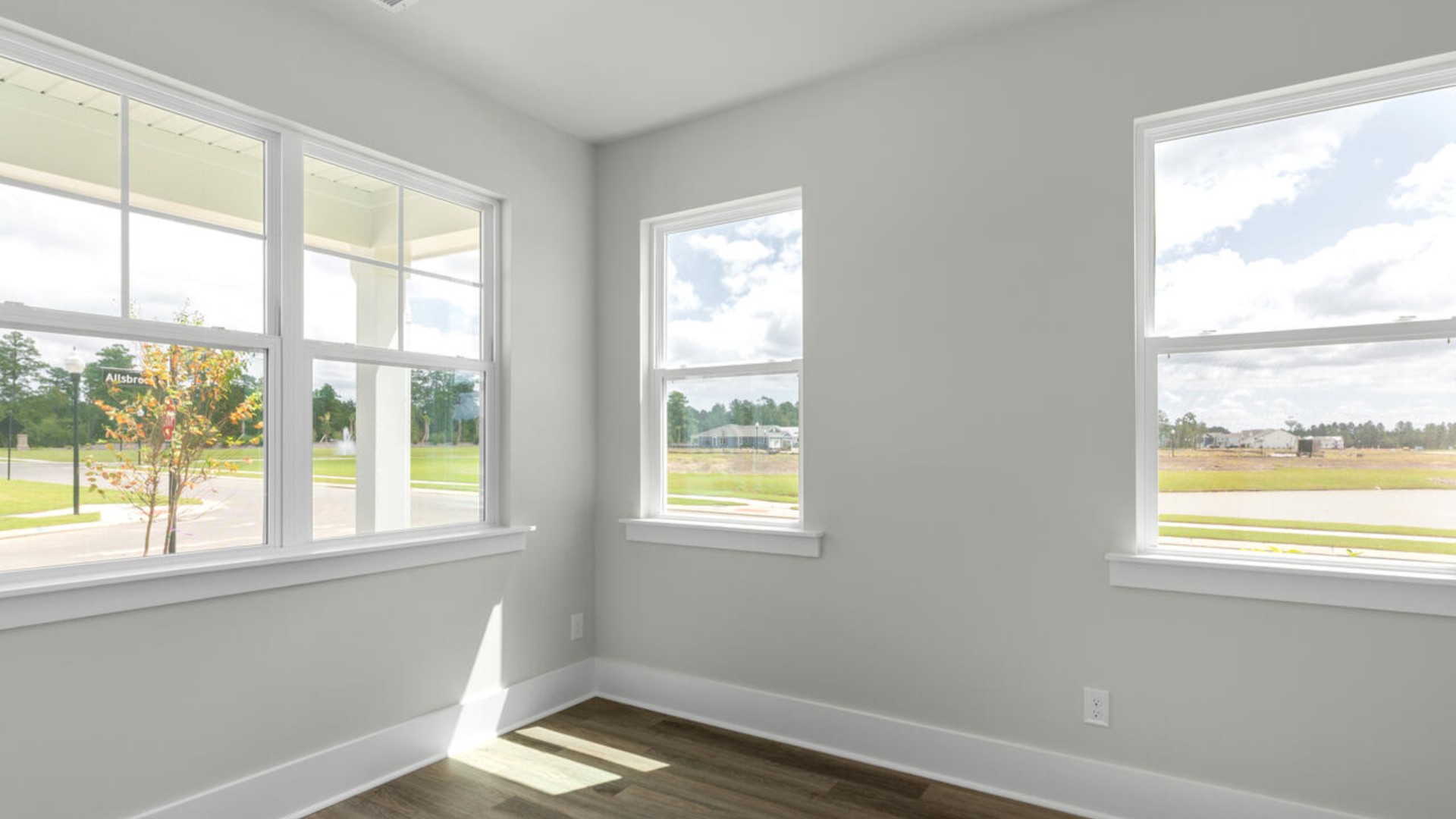 The Marion floorplan features an inviting covered front porch that opens into a formal dining room