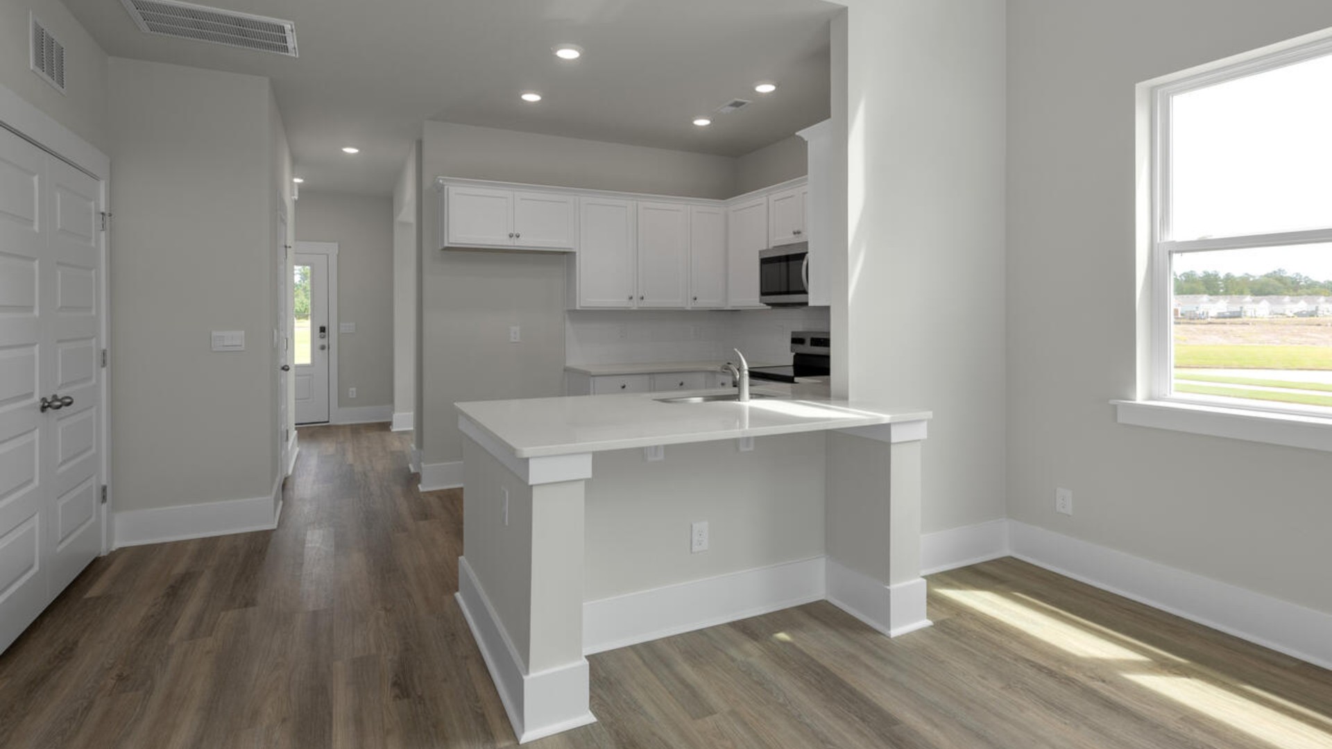 The Marion floorplan features an inviting covered front porch that opens into a formal dining room. The open concept living space is anchored by a spacious kitchen with granite countertops, stainless steel appliances and a large island that overlooks your family and dining room. Ideal for entertaining guests or enjoying family time while preparing meals.