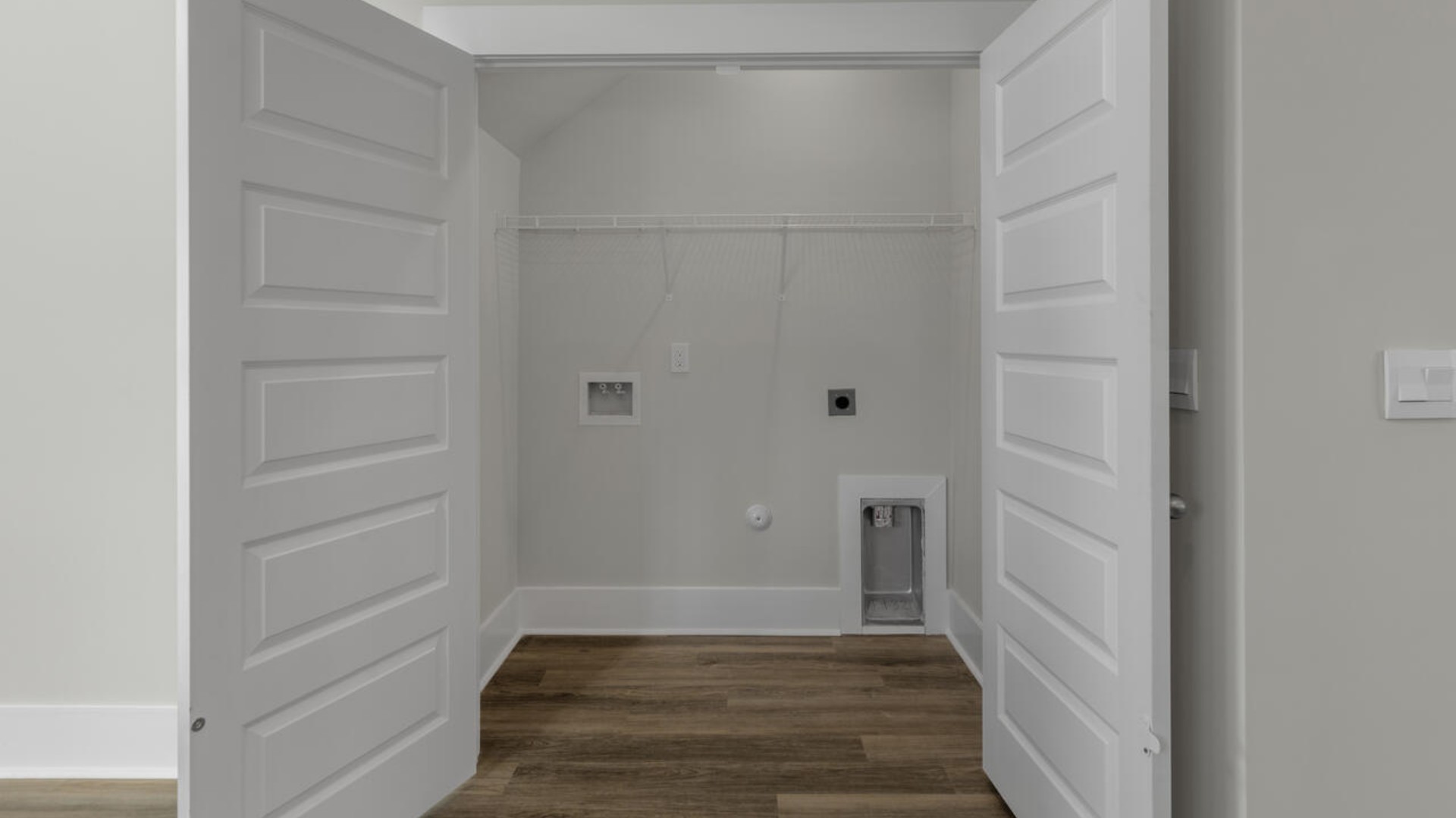 The first-floor primary bedroom boasts a large bath, double vanities and walk-in closet. On the second floor, you are greeted by a versatile loft space, laundry room, two secondary bedrooms, and a full bath.