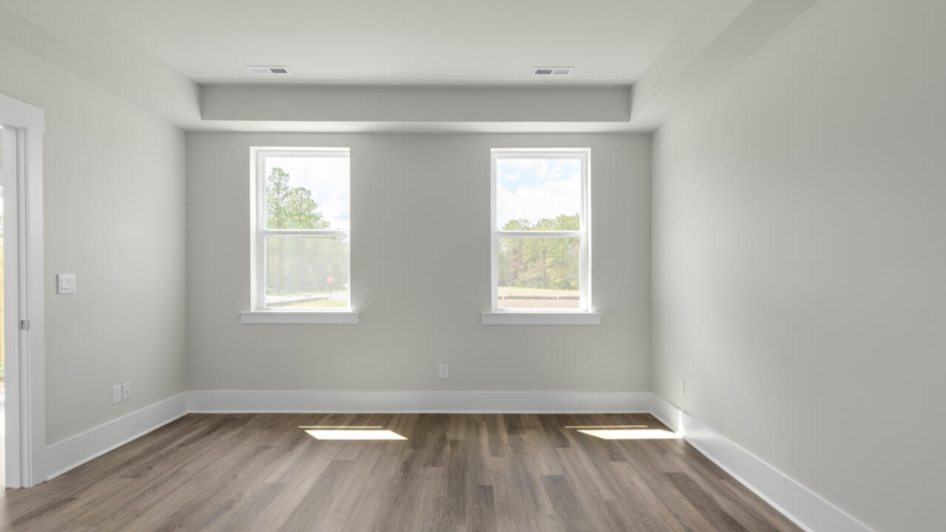 The first-floor primary bedroom boasts a large bath, double vanities and walk-in closet. On the second floor, you are greeted by a versatile loft space, laundry room, two secondary bedrooms, and a full bath.