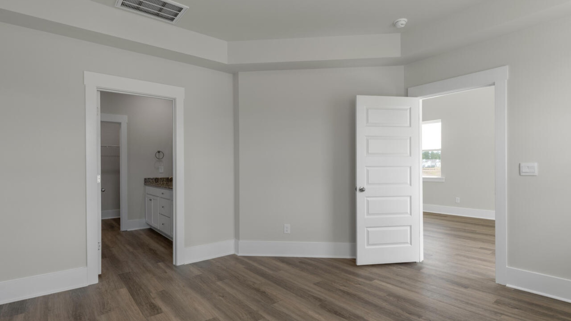 The first-floor primary bedroom boasts a large bath, double vanities and walk-in closet. On the second floor, you are greeted by a versatile loft space, laundry room, two secondary bedrooms, and a full bath.
