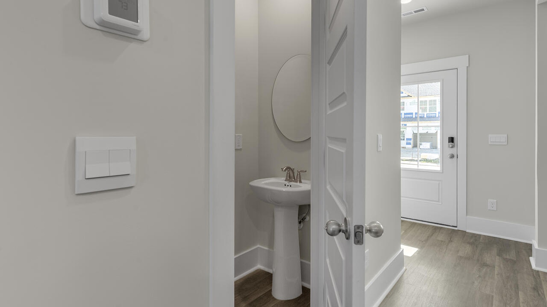 The first-floor primary bedroom boasts a large bath and walk-in closet.