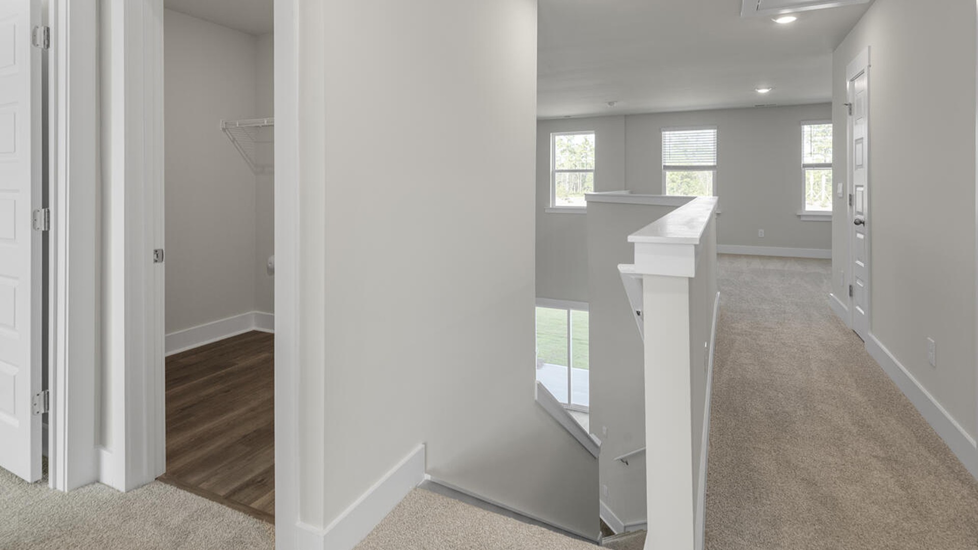 On the second floor, you are greeted by three additional bedrooms, two full bathrooms and laundry room