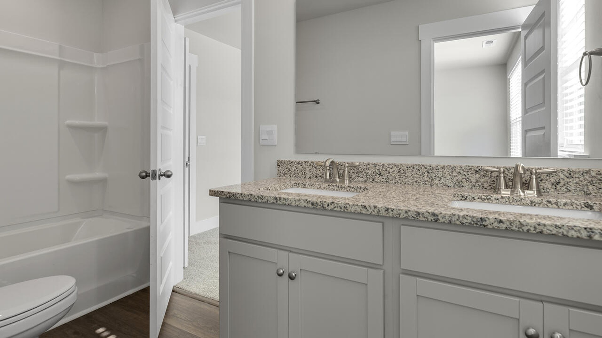 On the second floor, you are greeted by three additional bedrooms, two full bathrooms and laundry room