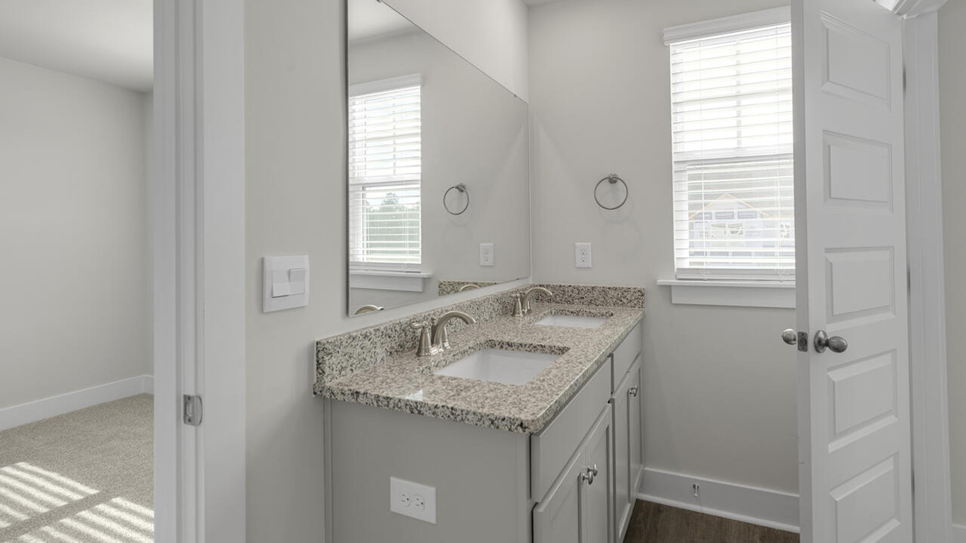 On the second floor, you are greeted by three additional bedrooms, two full bathrooms and laundry room