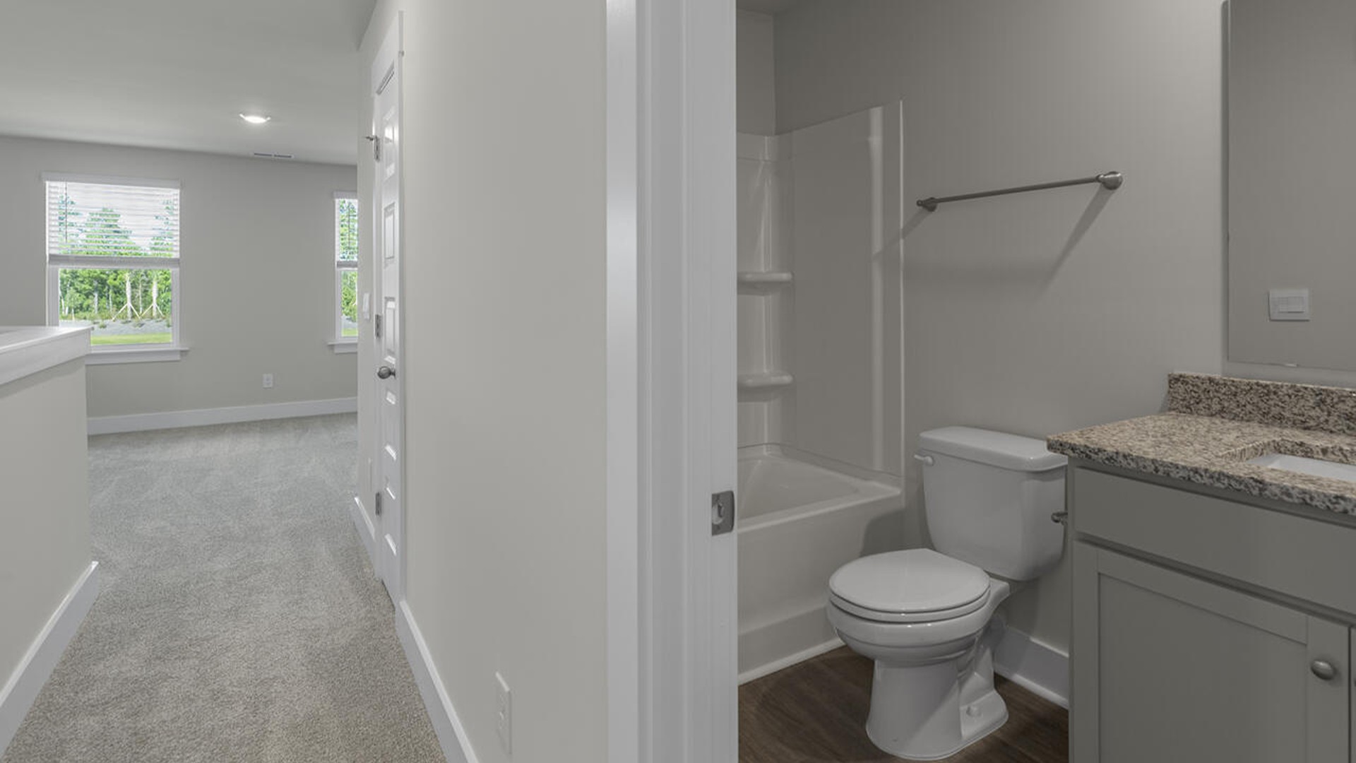 On the second floor, you are greeted by three additional bedrooms, two full bathrooms and laundry room