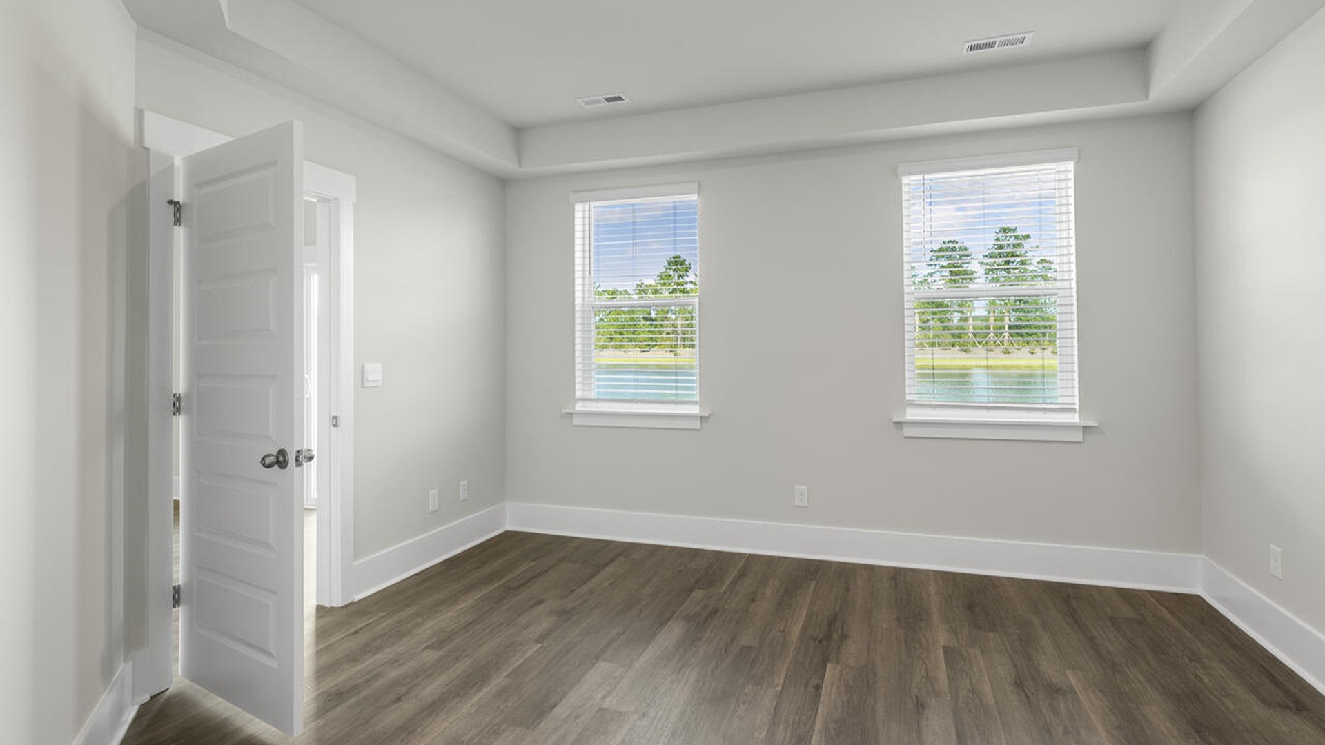 The Marion floorplan features an inviting covered front porch that opens into a formal dining room and open concept living space.