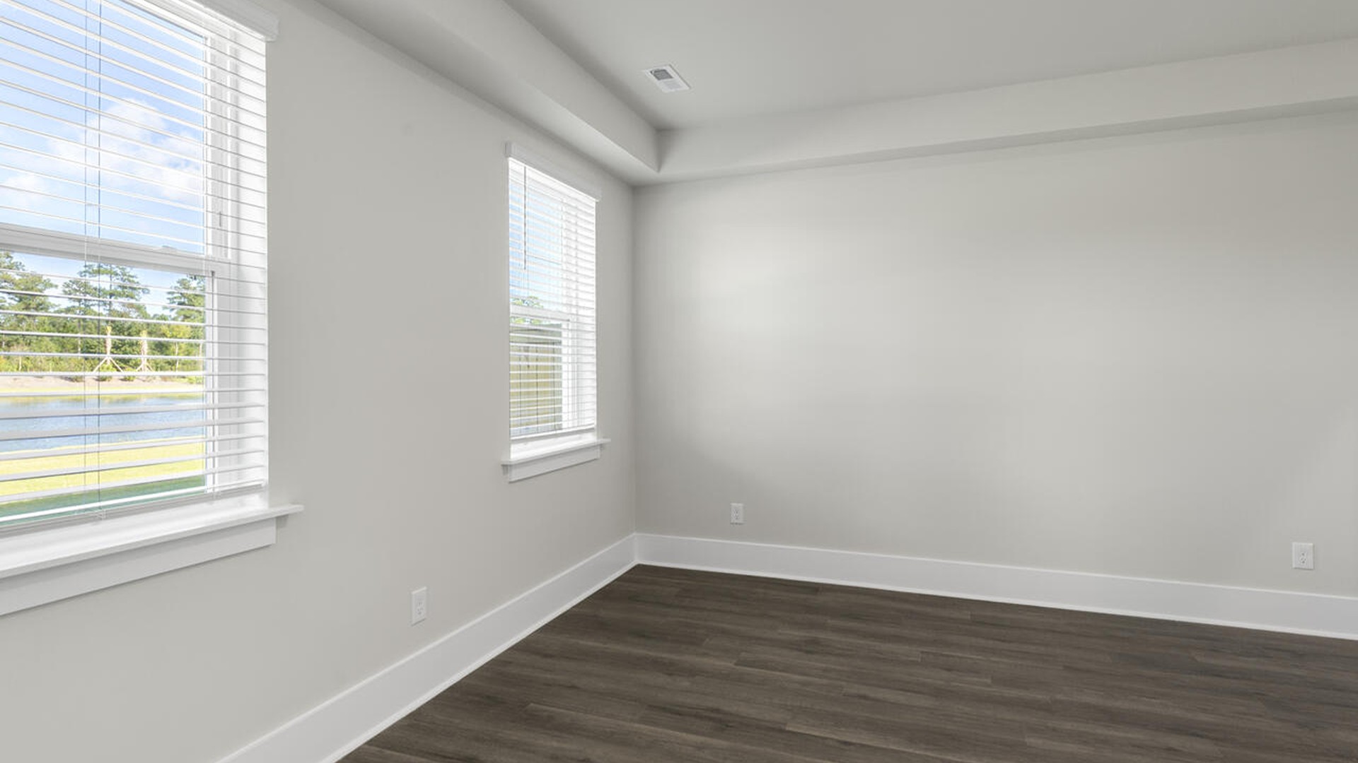 The Marion floorplan features an inviting covered front porch that opens into a formal dining room and open concept living space.
