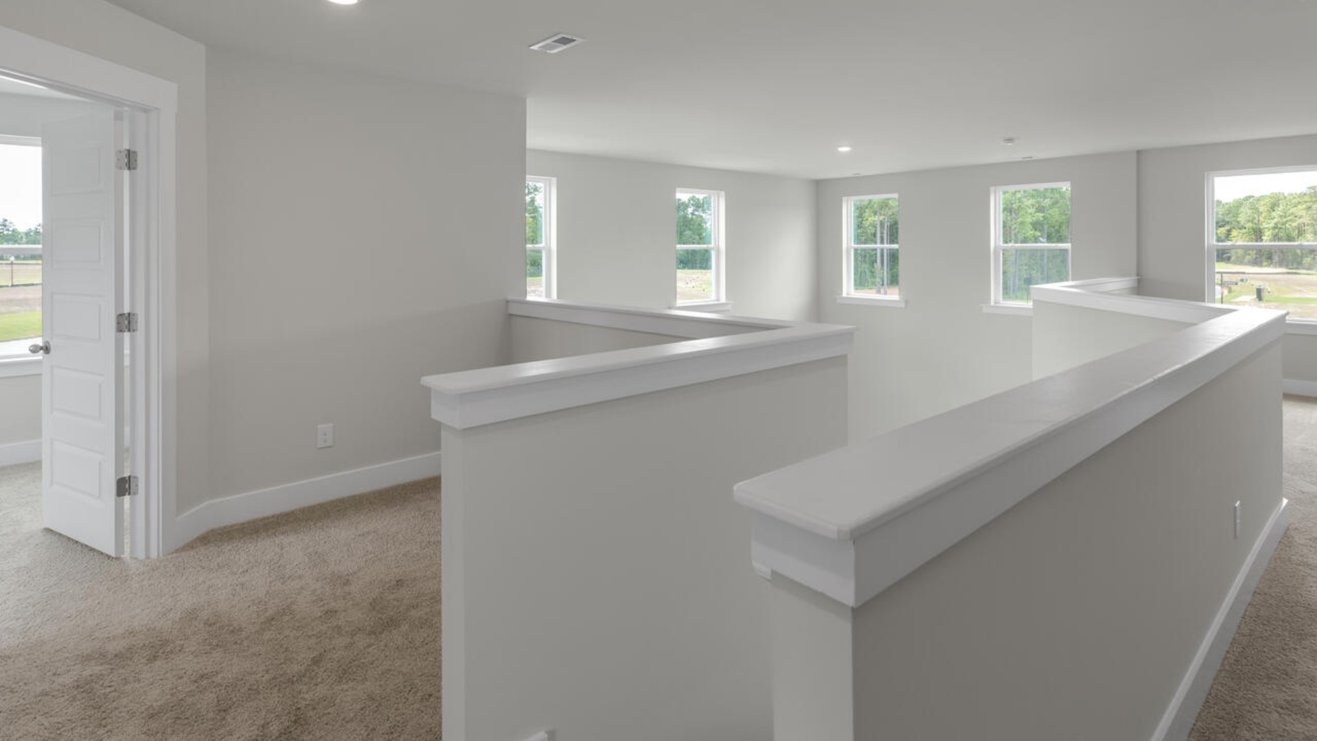 On the second floor, you are greeted by a two additional bedrooms, full bathroom, versatile loft space, and laundry room.