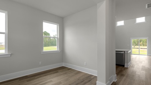 The Marion floorplan features an inviting covered front porch that opens into a formal dining room. The open concept living space is anchored by a spacious kitchen with granite countertops, stainless steel appliances and a large island that overlooks your family and dining room. Ideal for entertaining guests or enjoying family time while preparing meals.